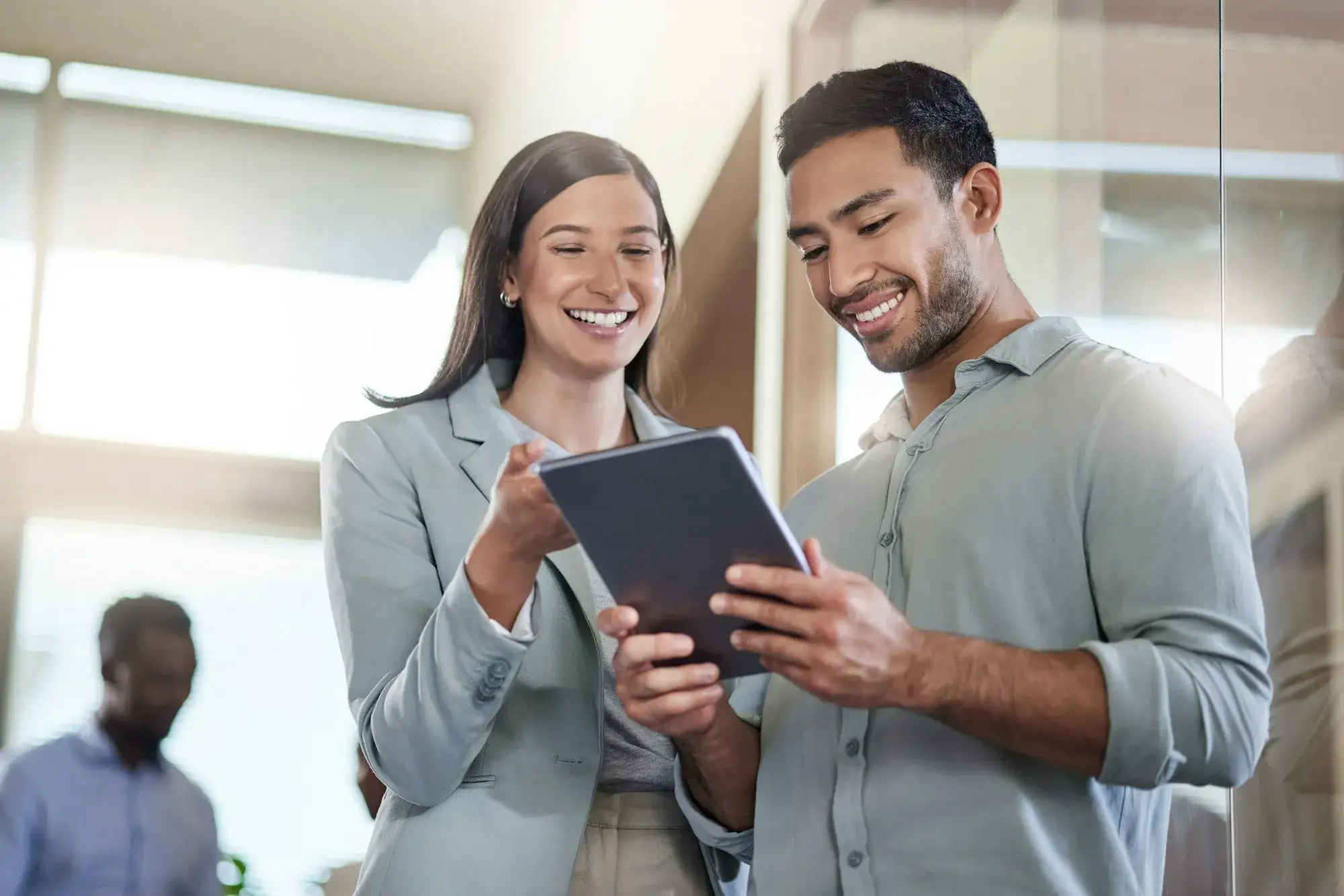 Coworker talking while using a tablet